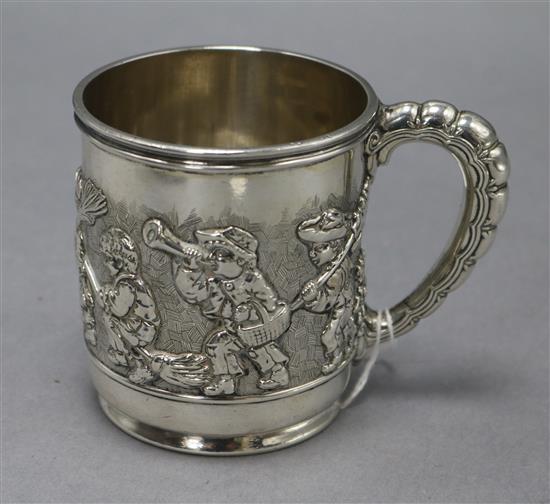 An early 20th century Tiffany & Co silver christening mug, decorated with children at play, import marks for London, 1908, 7.5 oz.